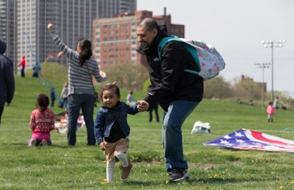 toddler and father in park