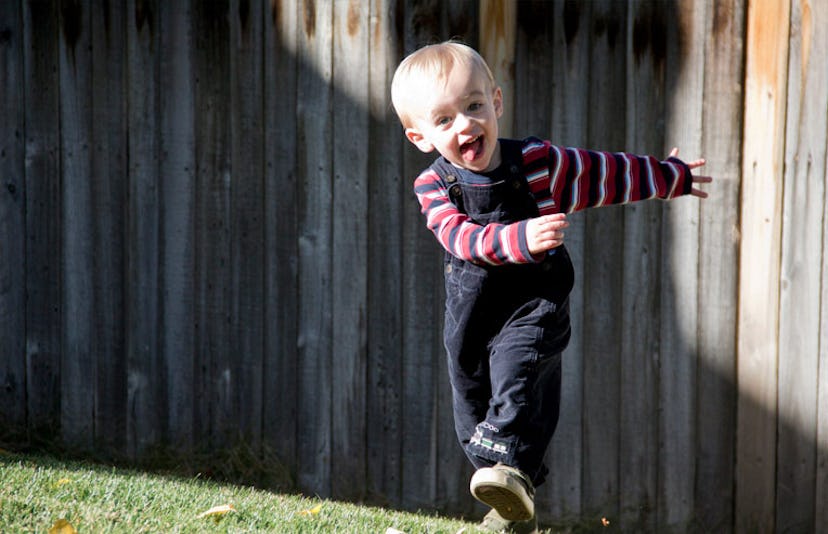 toddler jumping with tongue out