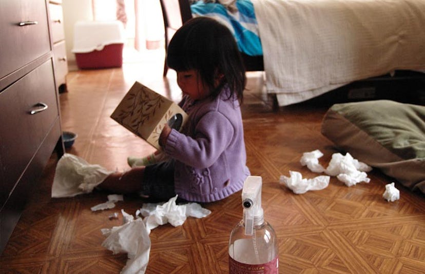 toddler playing with tissue box