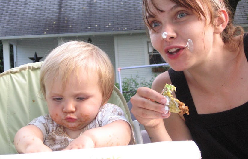 baby and mother eating tacos