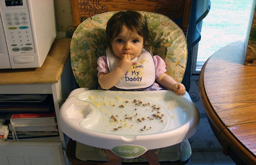 baby eating solid food
