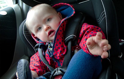 baby in car seat wearing coat