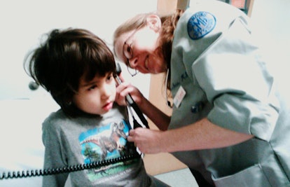 child being checked by pediatrician
