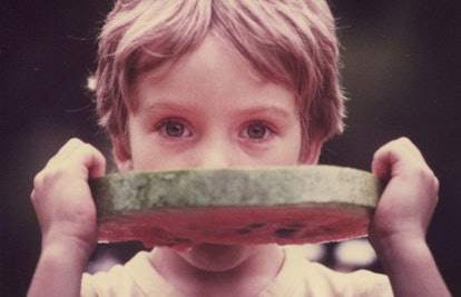 child eating watermelon slice