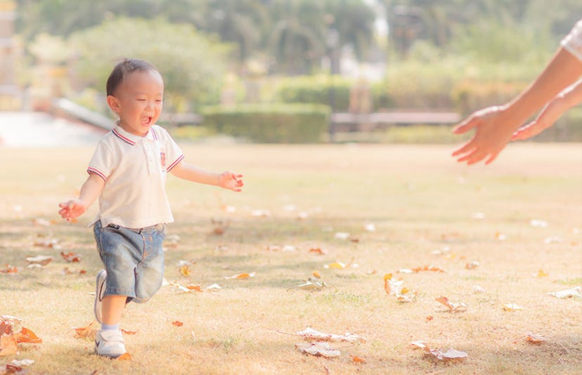 child running into parents arms