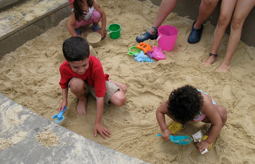 children playing in sandbox