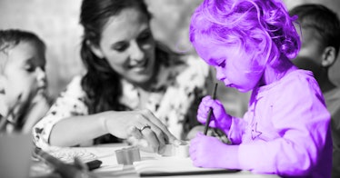 greyscale edit of child coloring in daycare with a nanny supervising
