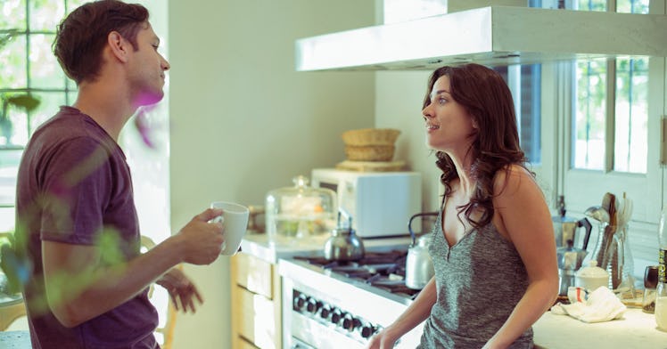 A man and a woman having an argument in their kitchen
