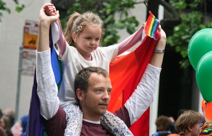 father and daughter at pride march