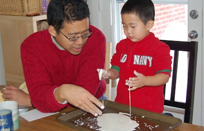 father and son playing with oobleck