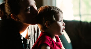 mother and baby by window