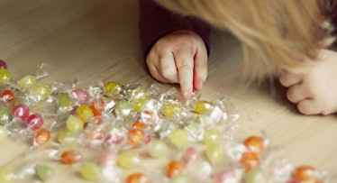 toddler counting her candies