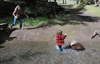 toddler running in river