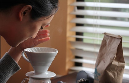 woman smelling coffee