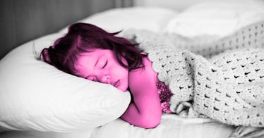 pink photo edit of a toddler sleeping in - against a black and white background