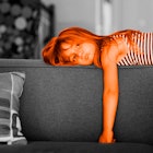 A kid bored on the couch