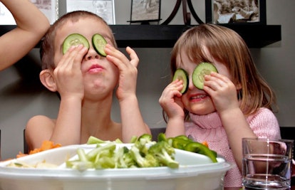children playing with cucumbers