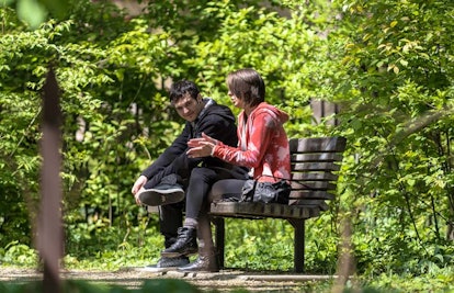 couple talking on bench