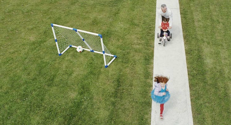 dad with kids in backyard