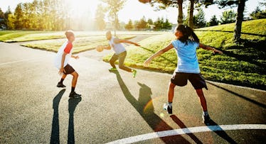 family playing basketball