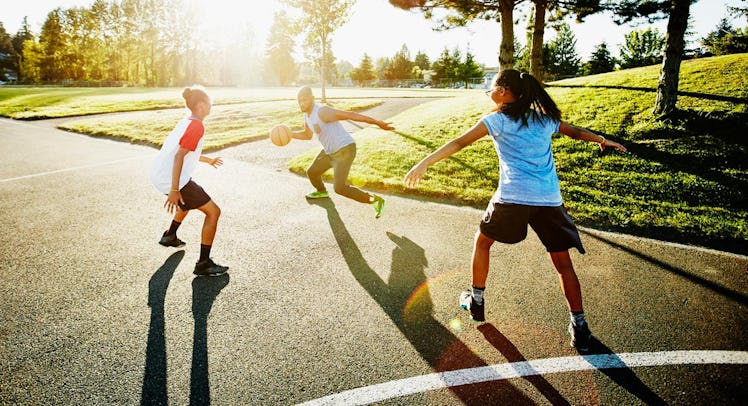 family playing basketball