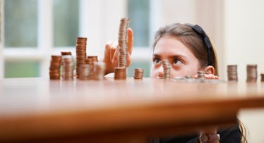 girl counting coins