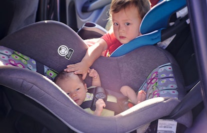 siblings in car seat