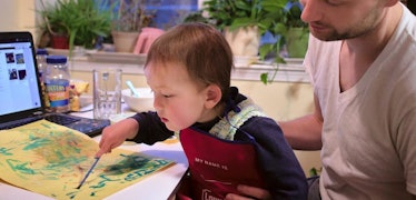 toddler and dad painting