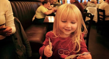 toddler eating in restaurant