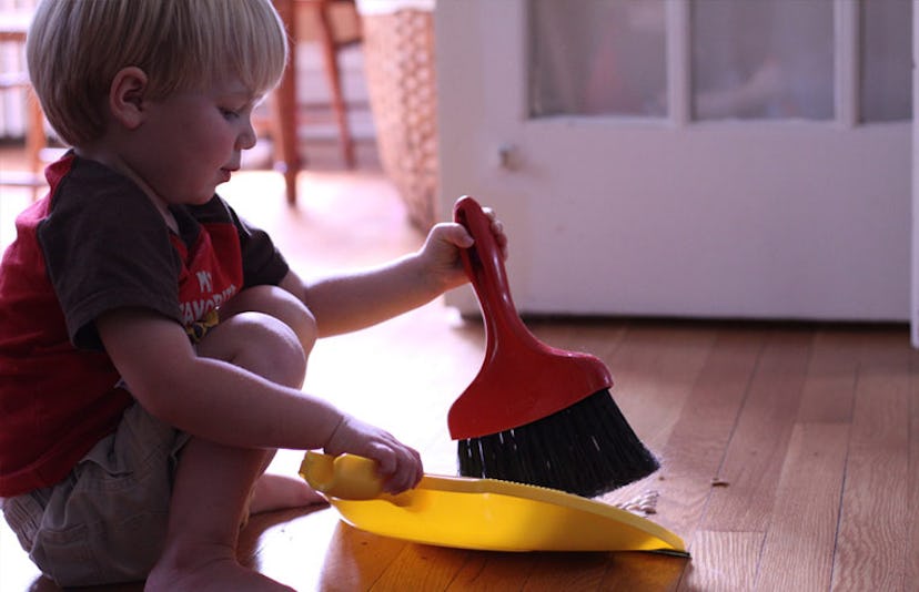toddler sweeping the floor
