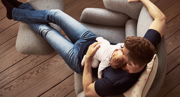 dad with baby on couch