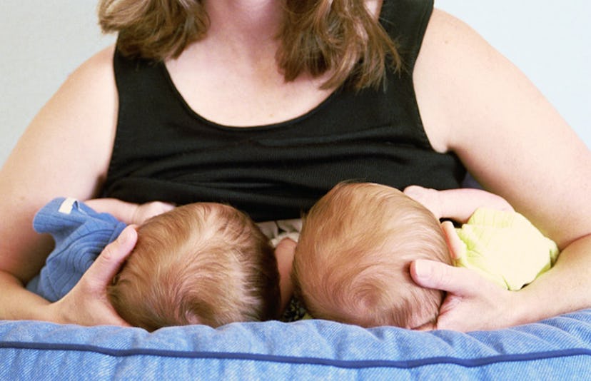 mom breastfeeding twins
