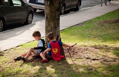 boys dressed up as batman and superman