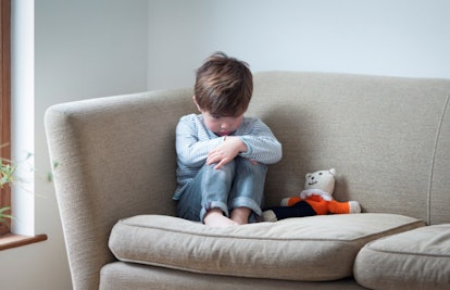 child sitting on couch