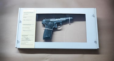 Close up of forensic science evidence box containing gun from crime scene