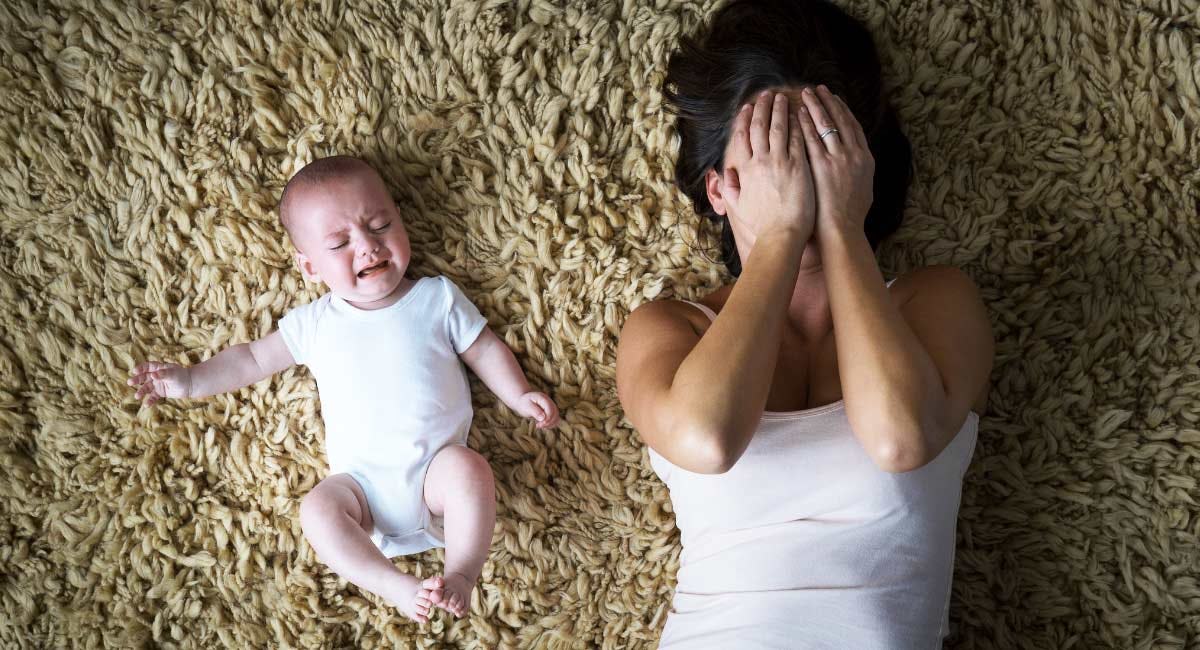 crying baby and depressed mom