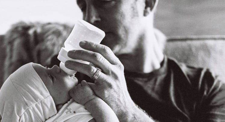 dad feeding baby