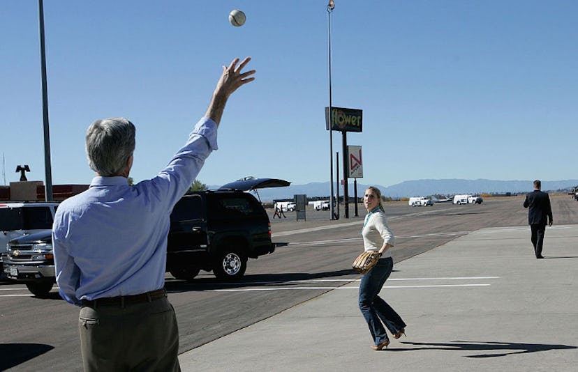 John Kerry wearing a baseball glove and throwing a baseball to Vanessa Kerry 