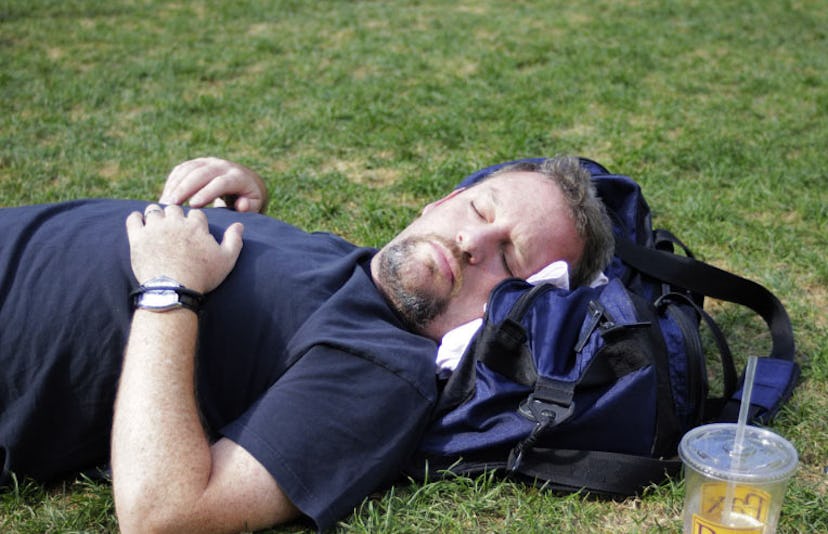 man sleeping on grass