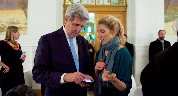 John Kerry and his daughter, Dr. Vanessa Kerry looking at something on John Kerry's phone