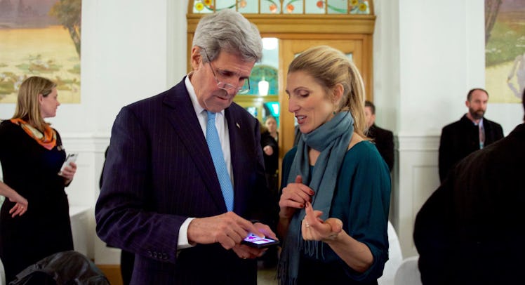 John Kerry and his daughter, Dr. Vanessa Kerry looking at something on John Kerry's phone 