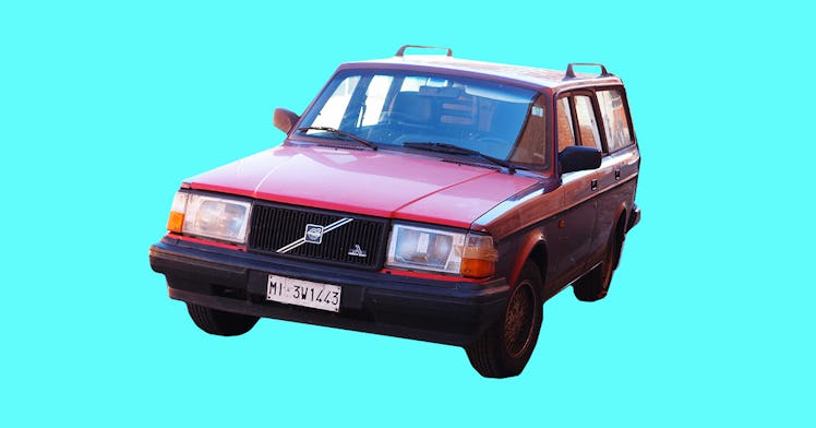 A red vintage Volvo 240 station wagon on a bright blue background
