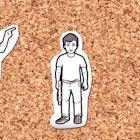 cut out paper figures depicting father yelling at a child on cork background