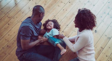 young parents and child in living room