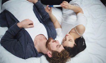 couple looking at pregnancy test