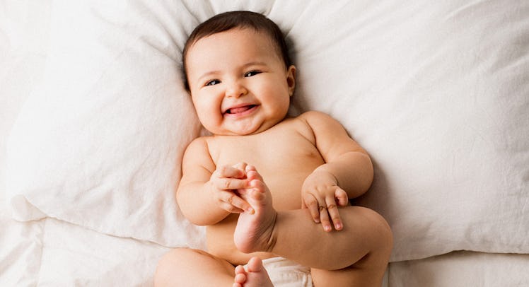 A large baby smiling.