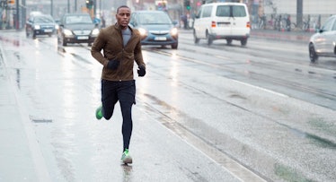 A man jogging in the rain