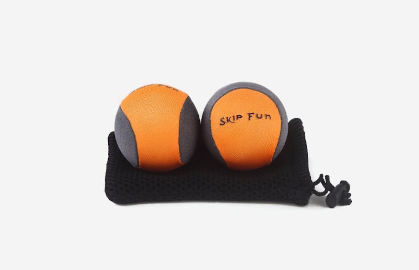 Two orange Skip Fun bouncy water balls