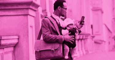 A man walking with his son down a street while wearing a formal suit