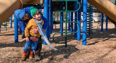 father and son in playground